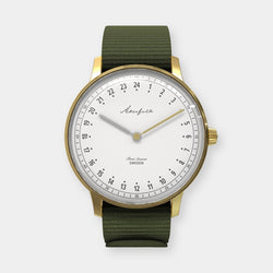 24-hour watch with gold case and green NATO strap