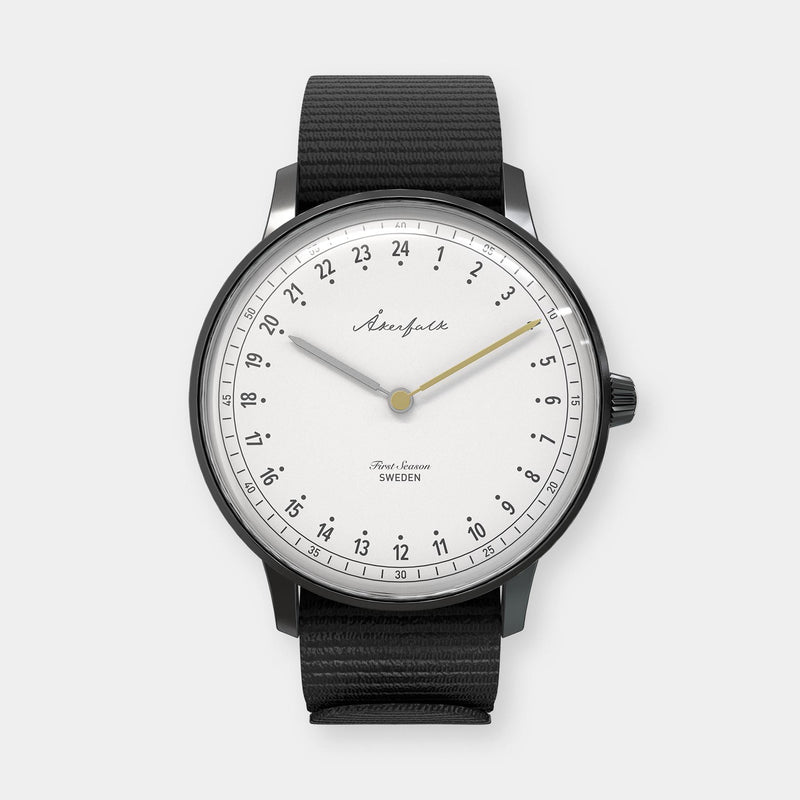 24-hour watch with matte black case and black NATO strap