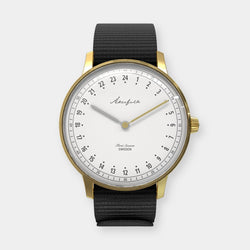 24-hour watch with gold case and black NATO strap