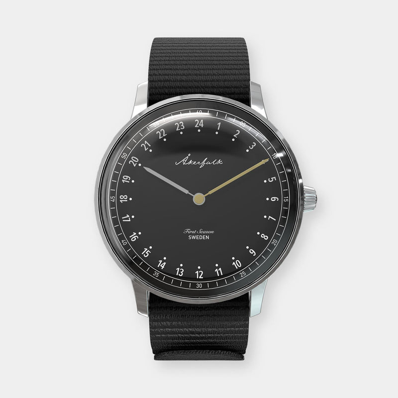 24-hour watch with silver case and black NATO strap