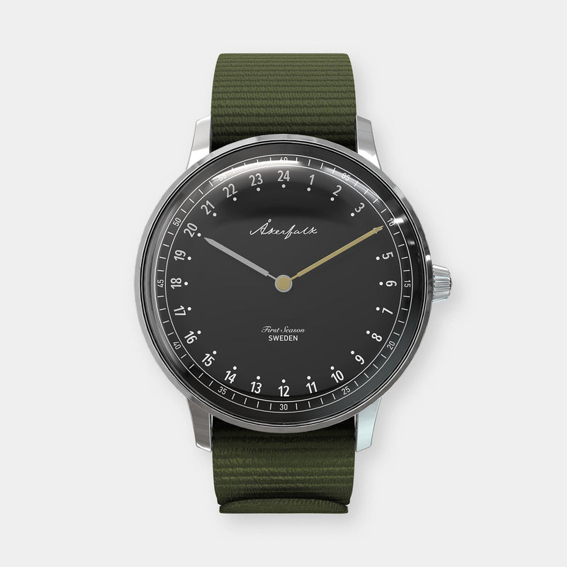 24-hour watch with silver case and green NATO strap
